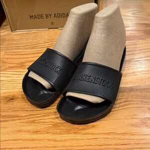 Birkenstock Women's Black Slide Sandals with Embossed Strap